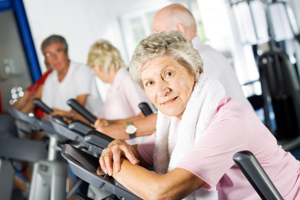 Seniors training in gym at senior living facility