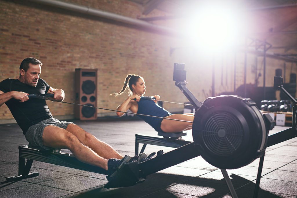 two people in rowing workouts studio