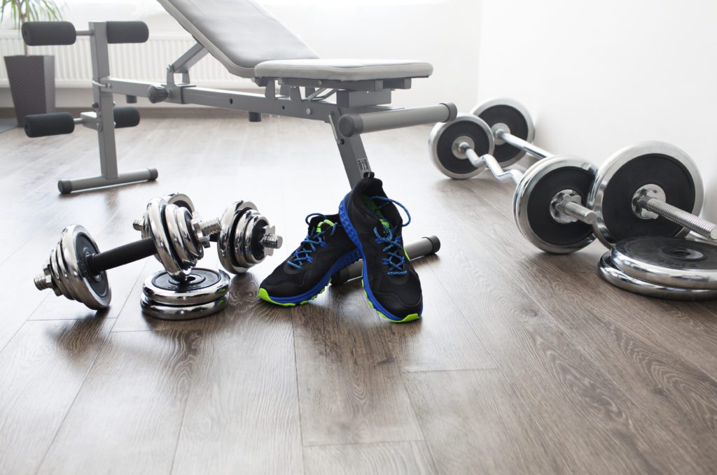 incline bench and dumbbells in home gym