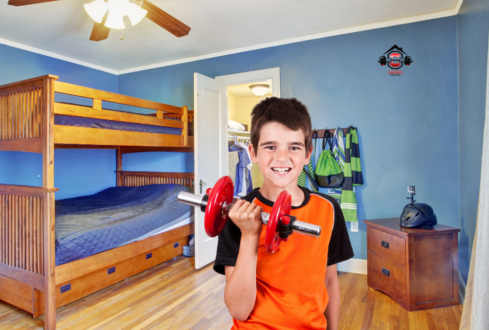boy in his room with a dumbbell from carters home gym