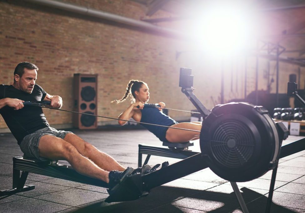 two people in rowing workouts studio